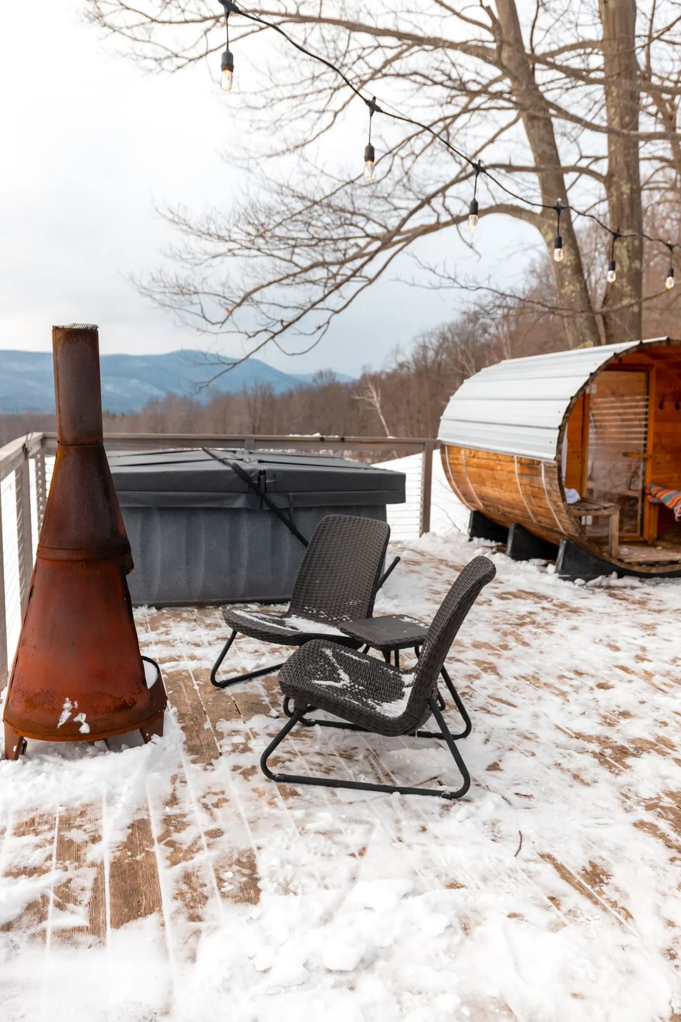 An outdoor sauna on a snowy deck, an alternative to a hot tub